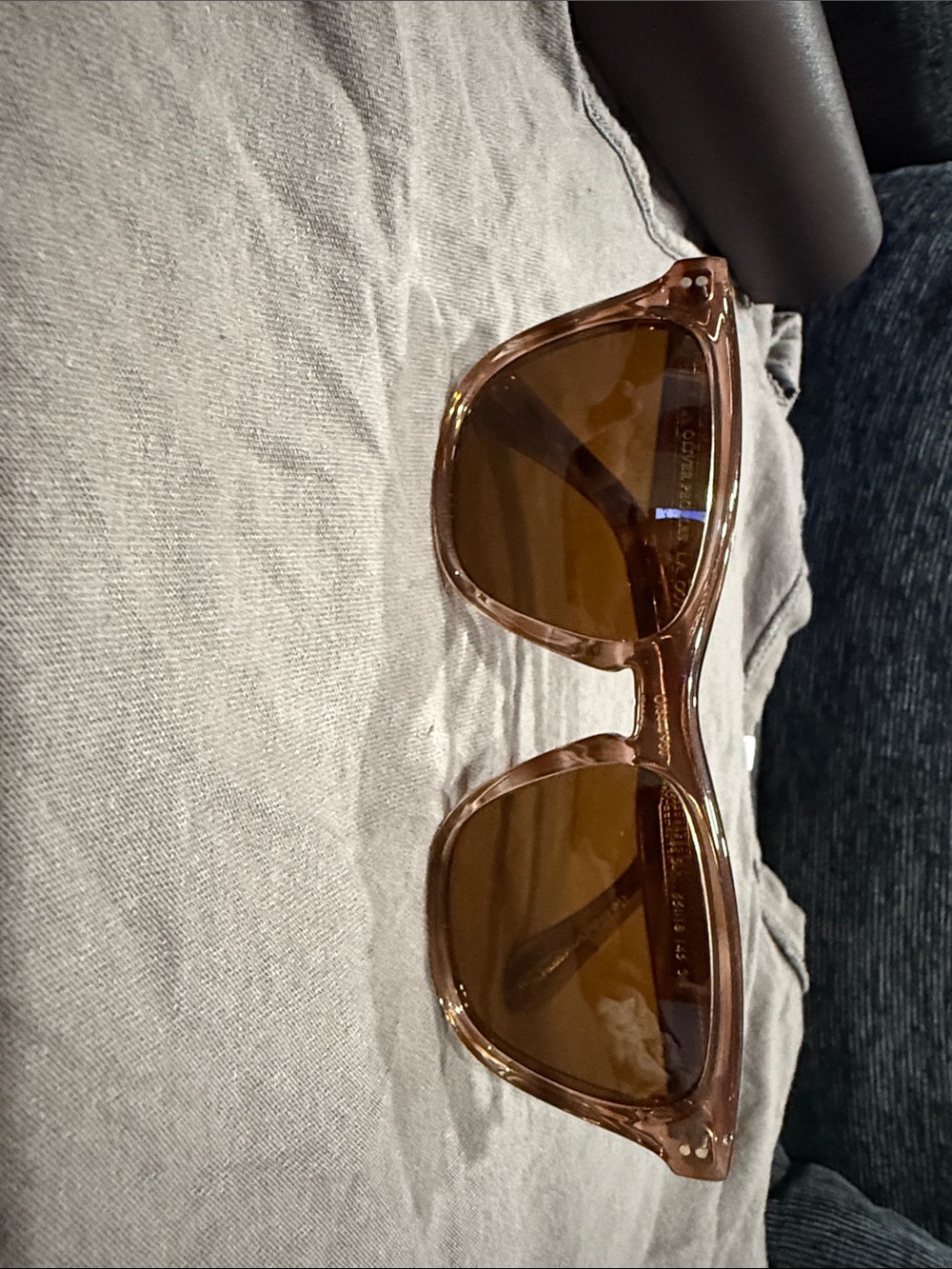Oliver Peoples Brown Transparent Frame Sunglasses with Brown Lenses.